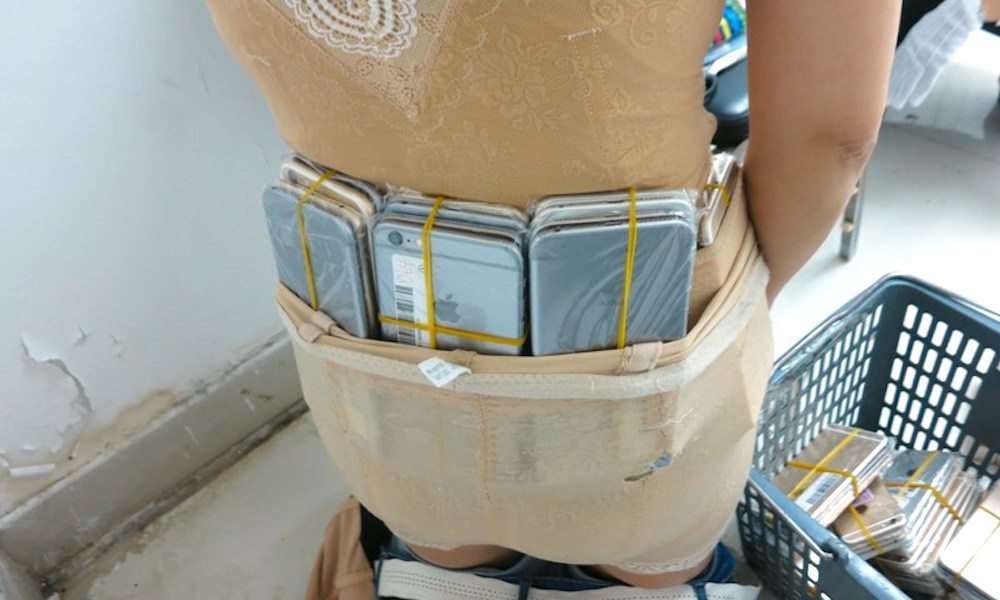Woman Caught Smuggling 102 iPhones Under Her Clothes