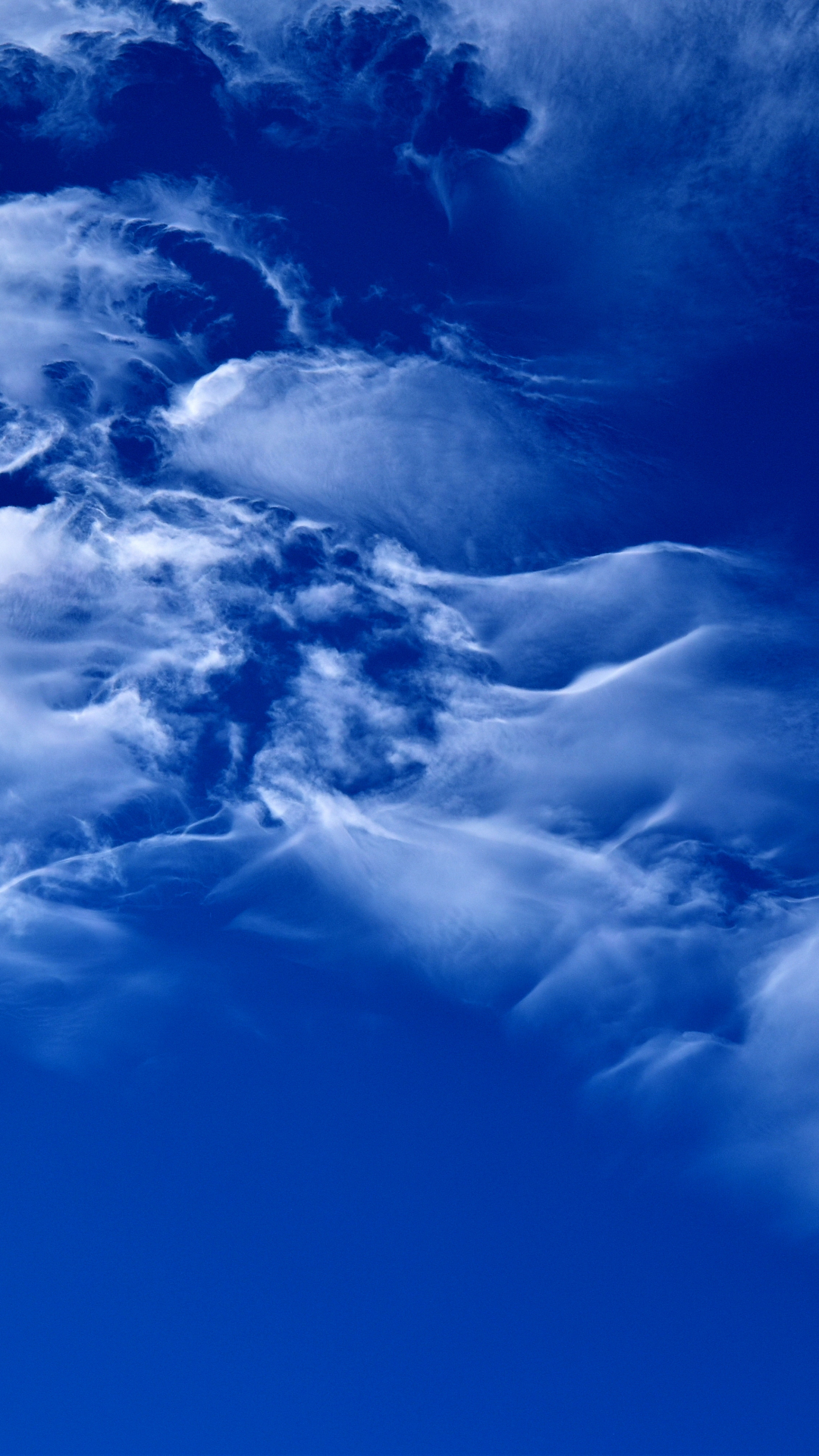 Clouds On A Bright Blue Sky iPhone Wallpaper