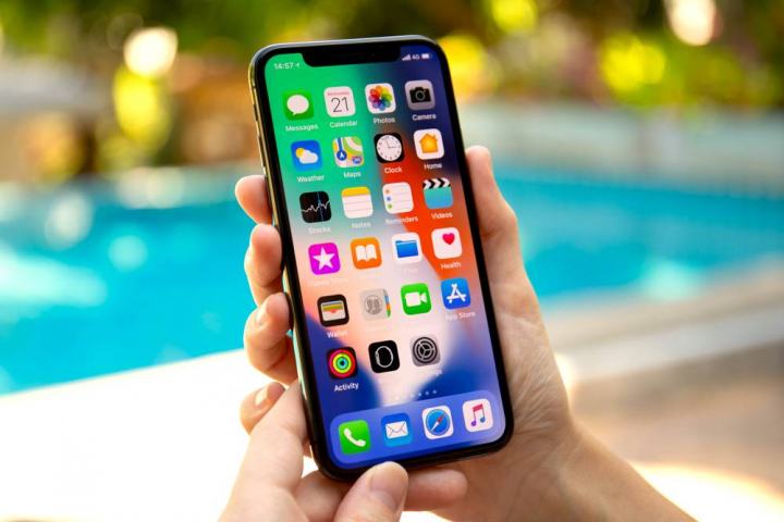 Holding Iphone X Ways To Lower Cell Phone Bill