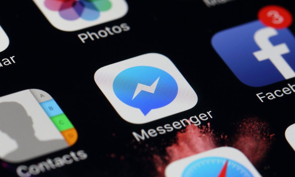 Facebook Messenger Icon on dark iPhone screen