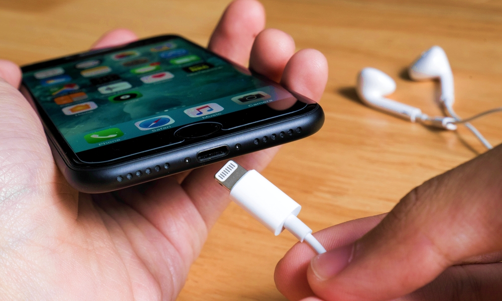 Plugging Lightning Cable into iPhone