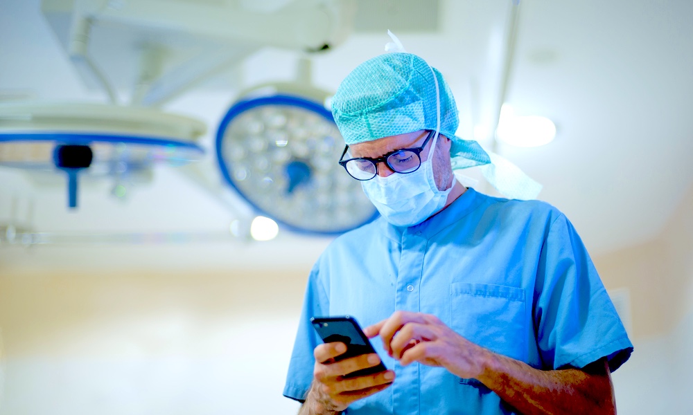 Doctor Using An Iphone Health Concerns
