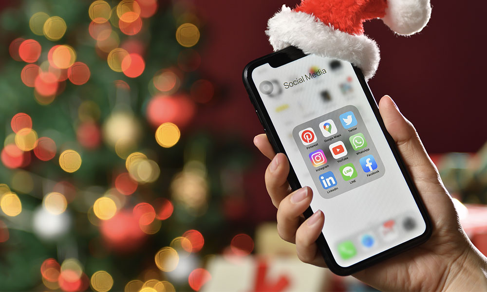 Christmas iPhone with tree and Santa hat