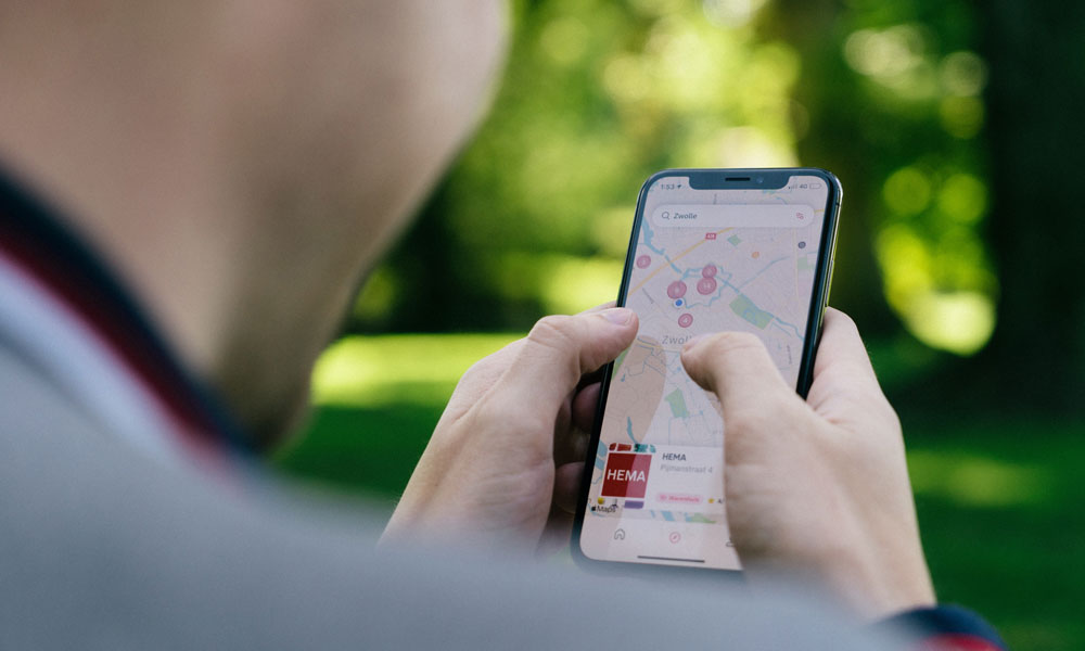 Man using Apple Maps app on iPhone