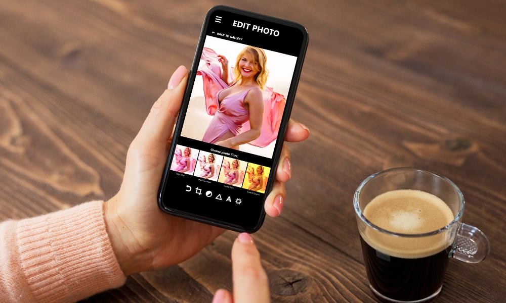 Person editing photo of woman on iPhone